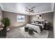 Cozy bedroom with soft natural light, neutral tones, ceiling fan, and comfortable carpeted floors at 861 S Ford Loop, Pahrump, NV 89048