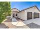 Charming single-story home featuring a two-car garage, desert landscaping, and a welcoming front entrance at 861 S Ford Loop, Pahrump, NV 89048