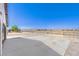 Expansive concrete patio area with gravel landscaping and views of the desert mountain range at 861 S Ford Loop, Pahrump, NV 89048