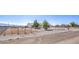 Wide view of gravel yard and home perimeter fencing on an expansive lot at 861 S Ford Loop, Pahrump, NV 89048
