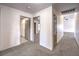 Bright hallway with carpet floors leading to the bedrooms and living spaces at 861 S Ford Loop, Pahrump, NV 89048