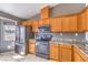 Well-equipped kitchen with stainless steel appliances, plentiful wood cabinetry, and durable countertops at 861 S Ford Loop, Pahrump, NV 89048