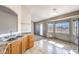 Sunny kitchen featuring stone counters, stainless sink, and mountain views at 861 S Ford Loop, Pahrump, NV 89048