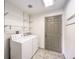 Functional laundry room with washer, dryer, shelving and convenient exterior access at 861 S Ford Loop, Pahrump, NV 89048