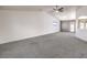 Open living room featuring vaulted ceiling, plush carpet, and lots of natural light at 861 S Ford Loop, Pahrump, NV 89048