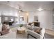 Bright, modern living room with stylish furniture, ceiling fan, and an open floor plan at 861 S Ford Loop, Pahrump, NV 89048