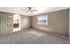 Large main bedroom boasts a ceiling fan, plush carpet and ensuite bathroom at 861 S Ford Loop, Pahrump, NV 89048