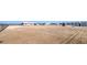 Spacious vacant lot showcases the building's potential, storage units, and distant mountain scenery at 861 S Ford Loop, Pahrump, NV 89048