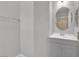 Bathroom with a large mirror, gray vanity, and updated hardware at 9467 Samuel Clemens Ct, Las Vegas, NV 89147