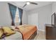Bedroom with a ceiling fan, window with curtains, and furniture at 9467 Samuel Clemens Ct, Las Vegas, NV 89147