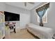 Cozy bedroom with a ceiling fan and a window at 9467 Samuel Clemens Ct, Las Vegas, NV 89147
