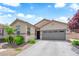 Charming single-story home features a well-maintained front yard and a two-car garage at 9467 Samuel Clemens Ct, Las Vegas, NV 89147