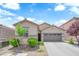 Charming single-story home features a well-maintained front yard and a two-car garage at 9467 Samuel Clemens Ct, Las Vegas, NV 89147