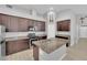 Beautiful kitchen with stainless steel appliances, an island sink, and granite countertops at 9467 Samuel Clemens Ct, Las Vegas, NV 89147