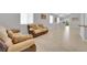 Inviting living room with light wood flooring, comfortable seating, and natural light at 9467 Samuel Clemens Ct, Las Vegas, NV 89147