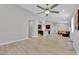 Spacious open-concept living area flows seamlessly with light wood floors and modern design at 9467 Samuel Clemens Ct, Las Vegas, NV 89147
