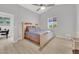 Bright main bedroom with a ceiling fan, a window, and neutral décor at 9467 Samuel Clemens Ct, Las Vegas, NV 89147