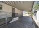 Spacious covered carport of home features metal roof and concrete flooring at 960 Third St, Pahrump, NV 89048