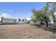 View of detached garage and single-story home at 960 Third St, Pahrump, NV 89048