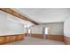 Open living room features carpeted flooring, wood trim accents and beamed ceilings at 960 Third St, Pahrump, NV 89048