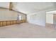 Bright living room has carpeted flooring and window with blinds for natural light at 960 Third St, Pahrump, NV 89048