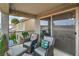 Cozy balcony with seating, planters, and a view of the surrounding neighborhood at 10031 Fletcher Peak Ave, Las Vegas, NV 89178