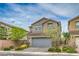Charming two-story home with a well-manicured lawn and a spacious two car garage at 10031 Fletcher Peak Ave, Las Vegas, NV 89178