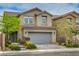 Charming two-story home with a well-manicured lawn and a spacious two car garage at 10031 Fletcher Peak Ave, Las Vegas, NV 89178
