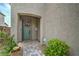 Charming covered front porch with a decorative wreath and inviting entrance at 10031 Fletcher Peak Ave, Las Vegas, NV 89178