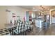 Stylish dining area with modern décor, flowing into the kitchen with stainless steel appliances at 10031 Fletcher Peak Ave, Las Vegas, NV 89178