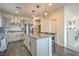 Bright kitchen featuring a large island with seating and modern appliances at 10031 Fletcher Peak Ave, Las Vegas, NV 89178