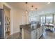 Modern kitchen featuring an island with seating and stainless steel appliances at 10031 Fletcher Peak Ave, Las Vegas, NV 89178