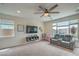 Bright living room with plush carpet and a cozy seating area, perfect for relaxing or entertaining at 10031 Fletcher Peak Ave, Las Vegas, NV 89178
