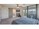 Bright main bedroom with sliding glass doors to the balcony, a barn door to the bathroom, and modern fixtures at 10031 Fletcher Peak Ave, Las Vegas, NV 89178