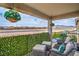 Inviting covered patio with comfortable seating and a view of the surrounding neighborhood at 10031 Fletcher Peak Ave, Las Vegas, NV 89178