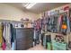 Walk-in closet with ample hanging space and a dresser for storage at 10031 Fletcher Peak Ave, Las Vegas, NV 89178
