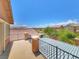 Enjoy the mountain view from this balcony with metal railing and a covered patio area at 10279 Montes Vascos Dr, Las Vegas, NV 89178