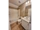 Bright bathroom featuring a shower-tub combo, a single sink, and modern fixtures at 10279 Montes Vascos Dr, Las Vegas, NV 89178