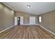 Spacious bedroom with vaulted ceilings, wood floors, track lighting, and dual closets at 10279 Montes Vascos Dr, Las Vegas, NV 89178