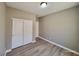 Simple bedroom design including closet, hard wood floors and neutral wall color at 10279 Montes Vascos Dr, Las Vegas, NV 89178