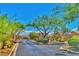 The entry to the gated community showcases desert landscaping and security features at 10279 Montes Vascos Dr, Las Vegas, NV 89178