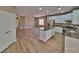 Well-designed kitchen with a central island, open to the living area for easy entertaining at 10279 Montes Vascos Dr, Las Vegas, NV 89178