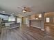 Open-concept living area featuring an island kitchen with stainless steel appliances at 10279 Montes Vascos Dr, Las Vegas, NV 89178
