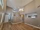 Bright living room with hardwood floors, high ceilings and a modern chandelier at 10279 Montes Vascos Dr, Las Vegas, NV 89178