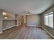 Spacious living room featuring hard wood floors, large window, and ceiling fan at 10279 Montes Vascos Dr, Las Vegas, NV 89178