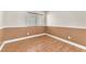 This bedroom features wood floors, neutral walls, and a window that provides natural light at 1038 Beaver Crest Ter, Henderson, NV 89015