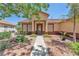 Inviting single-story home with a well-kept garden and covered entryway at 1038 Beaver Crest Ter, Henderson, NV 89015