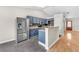 Modern kitchen with stainless steel appliances and stylish blue cabinetry at 1038 Beaver Crest Ter, Henderson, NV 89015