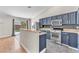 Well-lit kitchen with stainless steel appliances and a view of the backyard at 1038 Beaver Crest Ter, Henderson, NV 89015