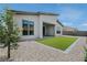 Beautiful backyard featuring low maintenance landscaping and artificial turf lawn at 11173 Concord Valley Dr, Las Vegas, NV 89135